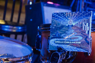 cd closeup wedged in drumkit