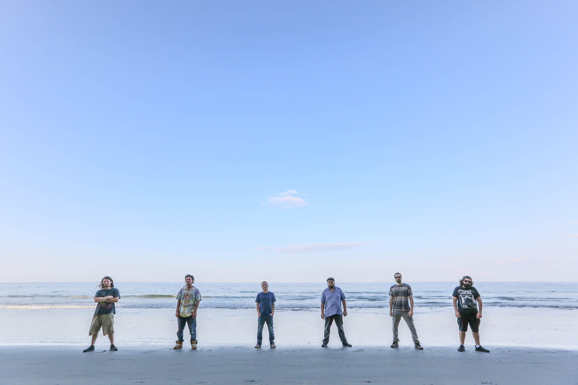 band in front of ocean